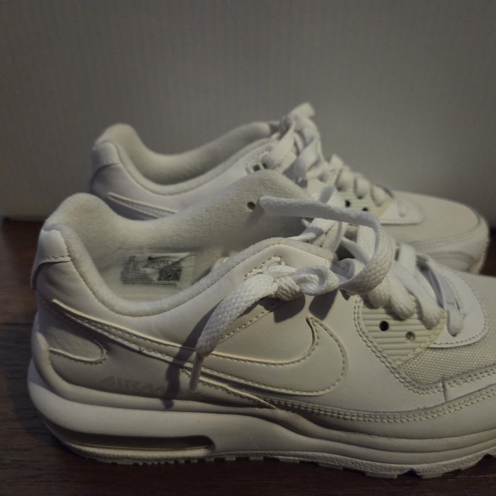 Nike White Sneakers with Classic Swoosh and Air Cushioning